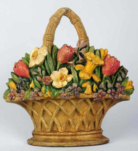 Appraisal: Cast Iron Tulips Daffodils Flower Doorstop Depicts tulips and daffodils