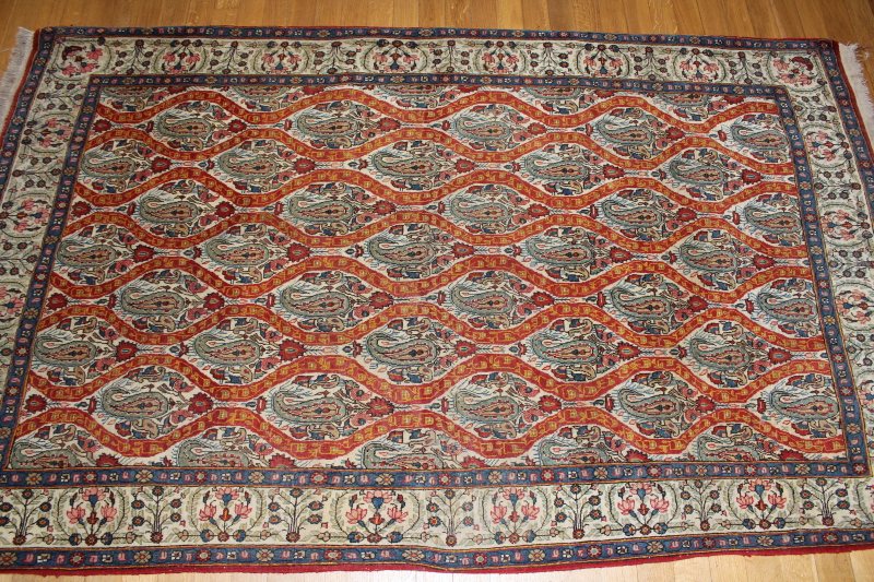 Appraisal: A Qum bordered rug cm x cm