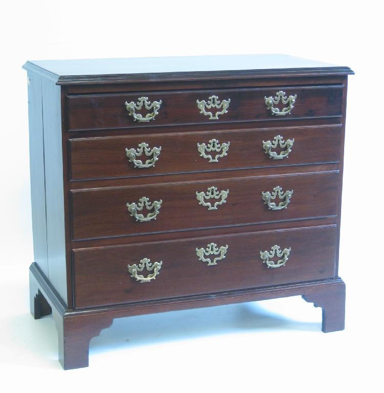 Appraisal: A George III mahogany Chest of four long graduated drawers