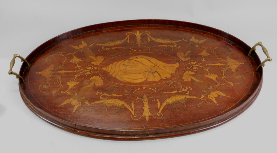 Appraisal: An Edwardian mahogany Sheraton revival style oval tray decorated in