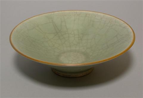 Appraisal: CHINESE CELADON-GLAZED CONICAL BOWL The circular bowl with steeply flaring