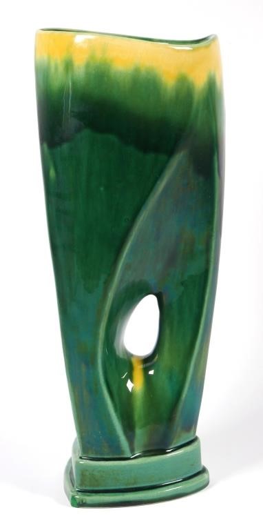 Appraisal: Free form gladiolus vase in green and yellow glaze Vase