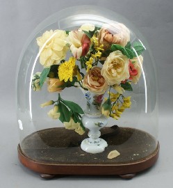 Appraisal: A vase containing Victorian wax flowers in a glass dome