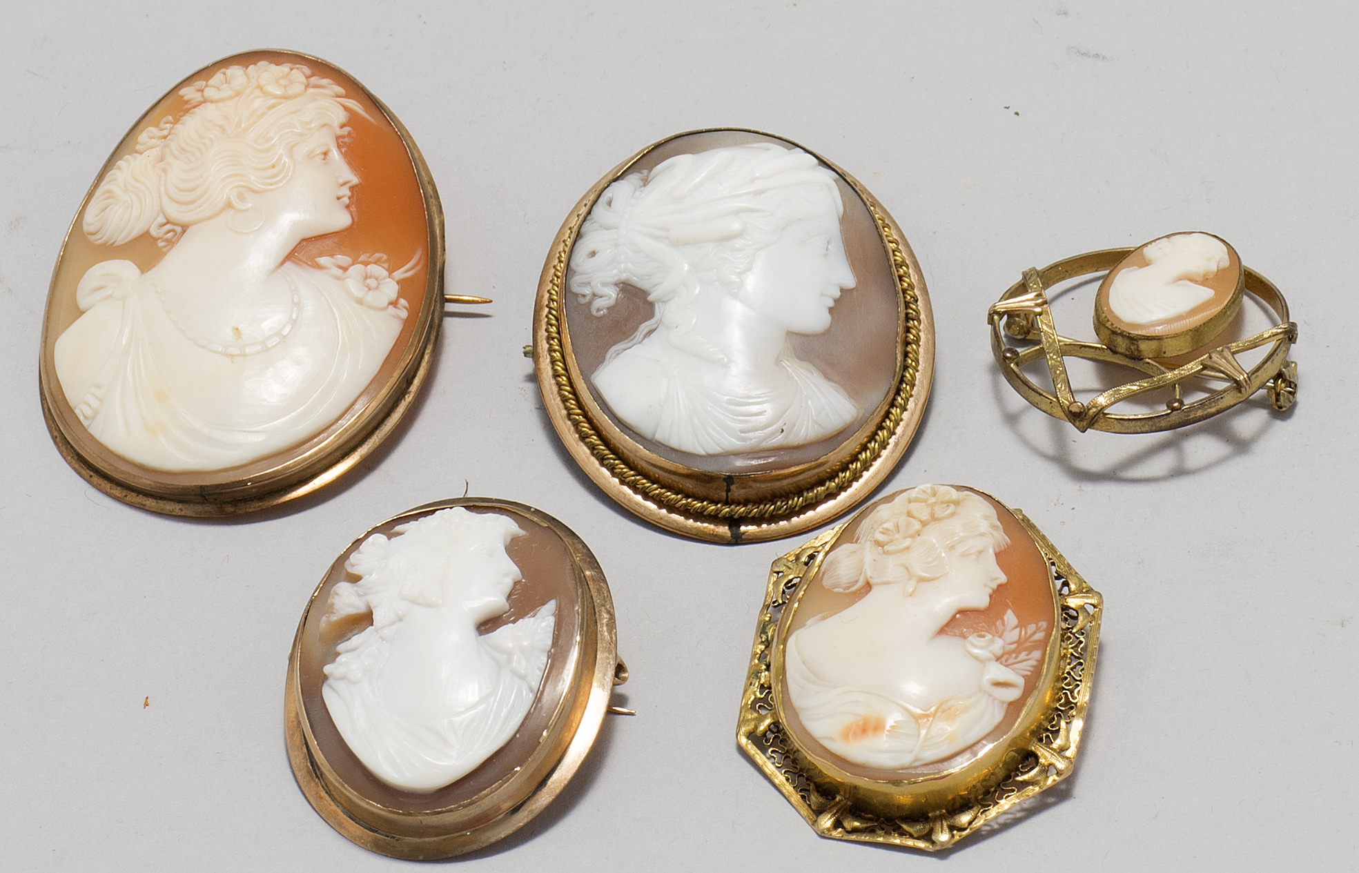 Appraisal: FIVE SHELL CAMEO BROOCHES All depicting profile portrait busts of