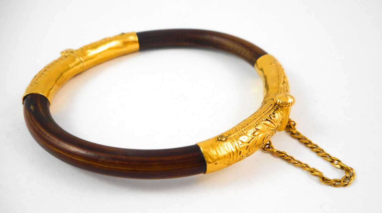 Appraisal: CHINESE BAMBOO AND TWENTY-FOUR KARAT GOLD BANGLE The hinged round