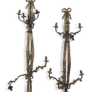 Appraisal: A Pair of Large Louis XVI Style Bronze Seven-Light Sconces