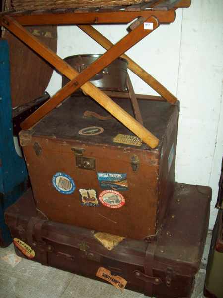 Appraisal: TWO LEATHER TRAVERING TRUNKS TWO CANE BASKETS ONE WOODEN FOLD