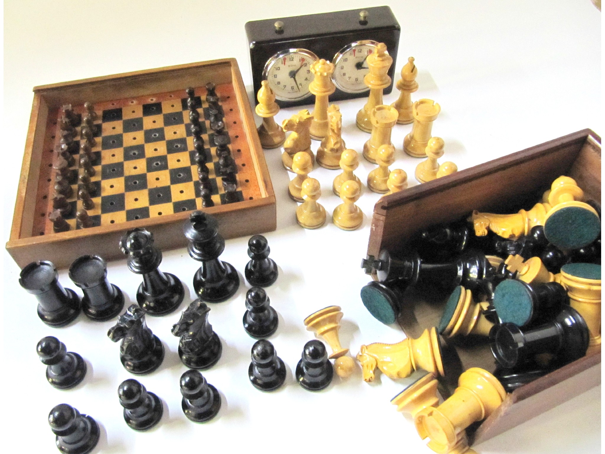 Appraisal: A lot comprising two sets of chessmen a travel chess