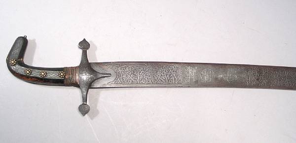 Appraisal: An Indo-Persian shamshir th century Broad curved inch blade etched