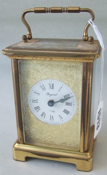 Appraisal: A gilt brass eight day carriage clock the circular dial