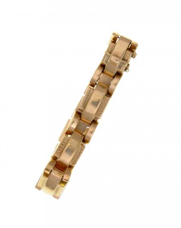 Appraisal: A GOLD BRACELET of curved geometric panels with pairs of