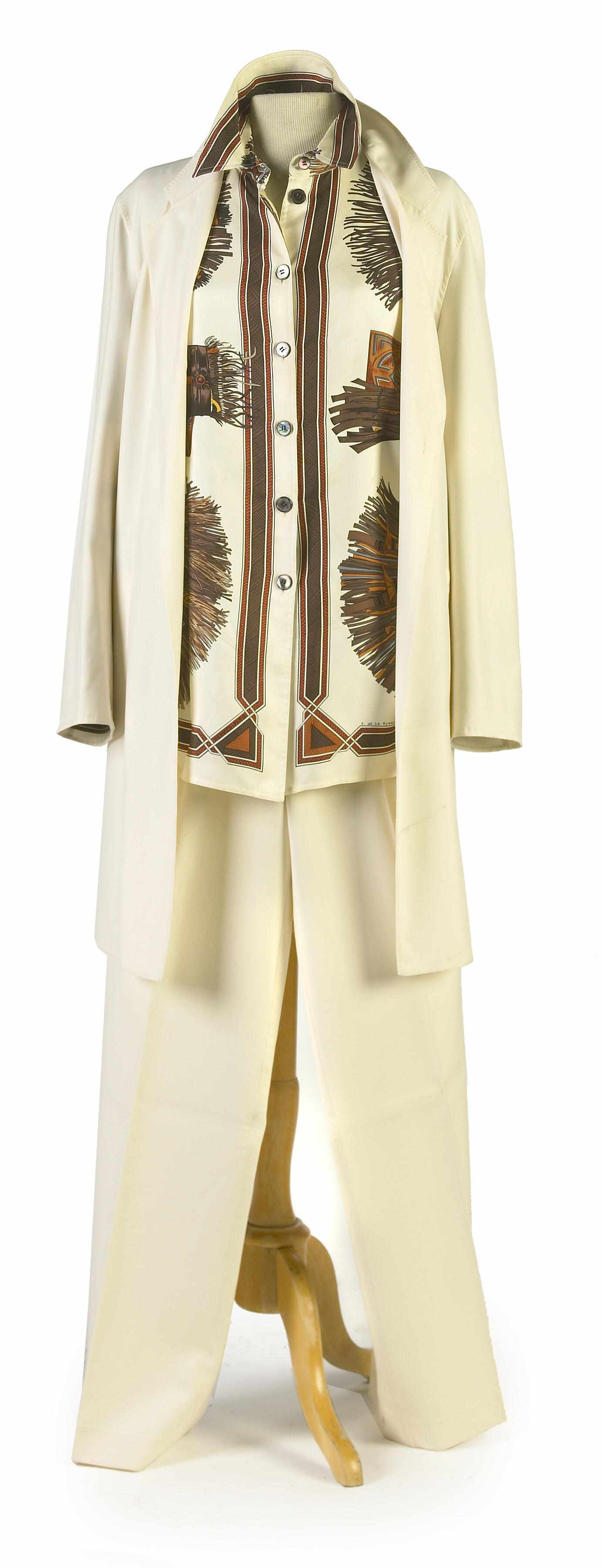 Appraisal: An Hermes cream coat and pant with an ivory and