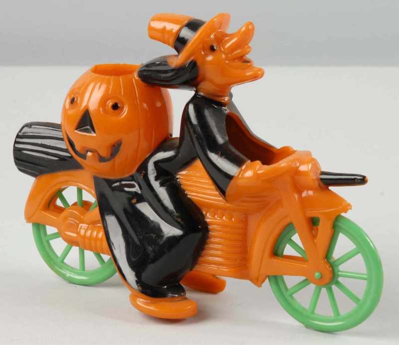 Appraisal: Plastic Witch on Bike Halloween Piece Description s Witch has