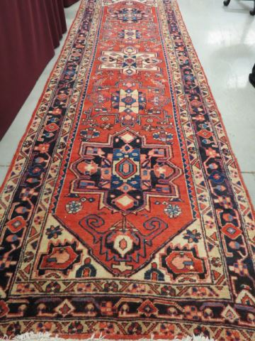 Appraisal: Heriz Persian Handmade Runner geometric medallions red white blue '