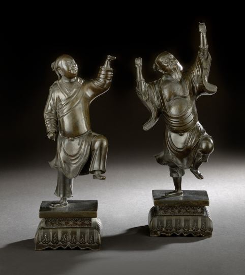 Appraisal: Two Chinese Bronze Figures of Acrobats th century each dressed