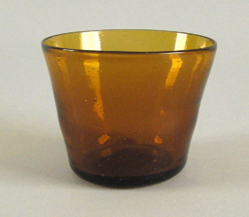 Appraisal: Heavy blown golden amber glass deep bowl ca with flaring