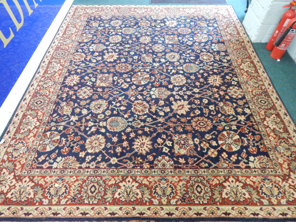 Appraisal: A machine woven carpet with a design of flowers on