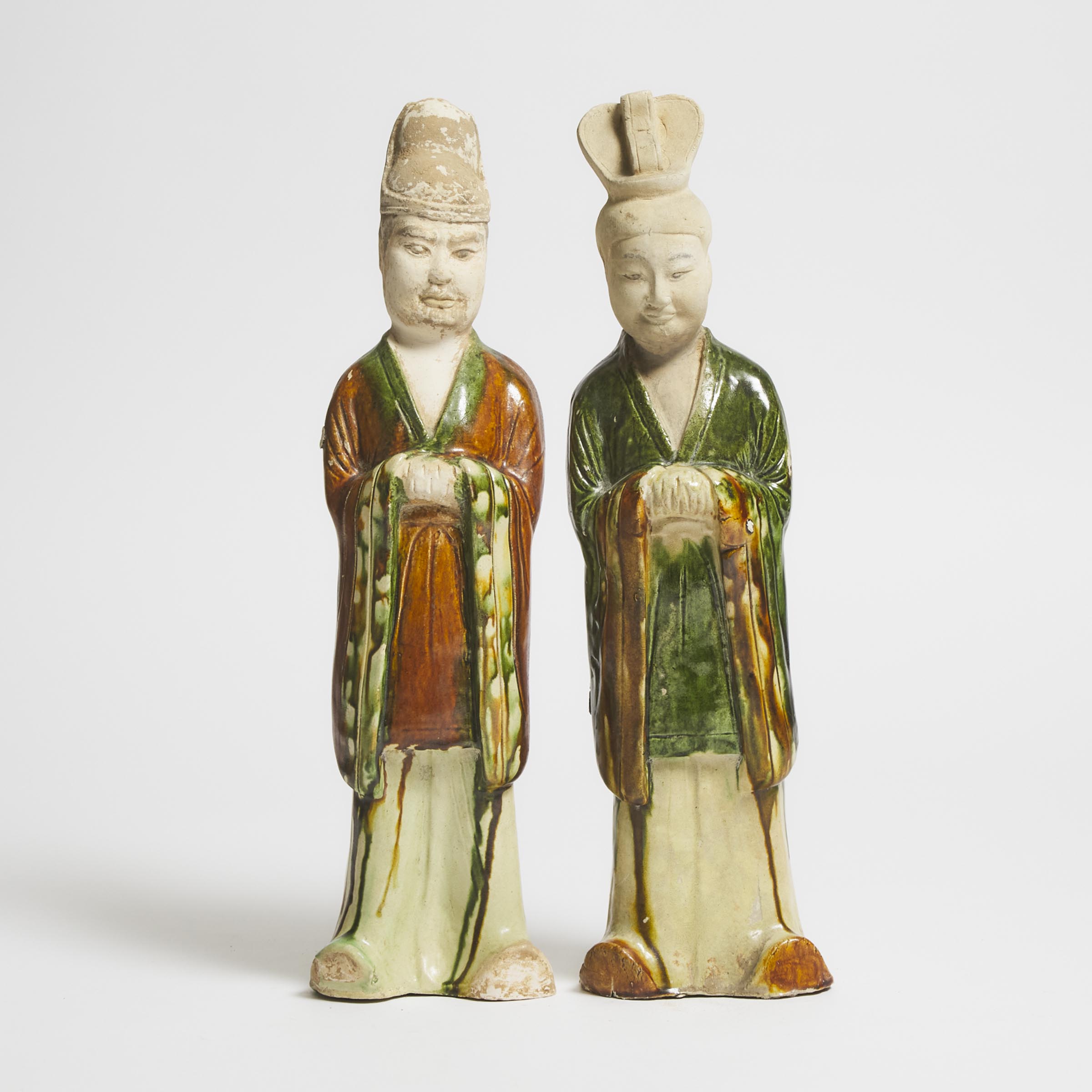 Appraisal: A Pair of Sancai-Glazed Pottery Figures of Attendants Tang Dynasty