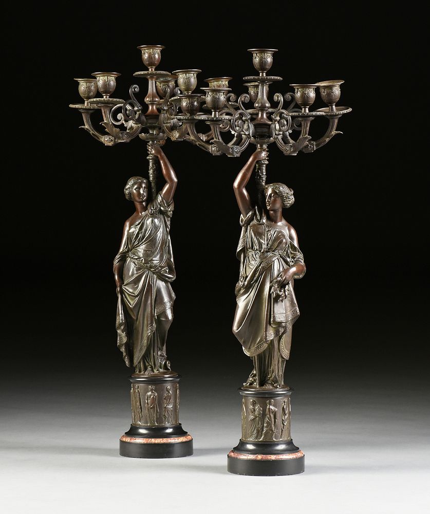 Appraisal: A PAIR OF NEOCLASSICAL REVIVAL FEMALE FIGURAL SIX LIGHT PATINATED