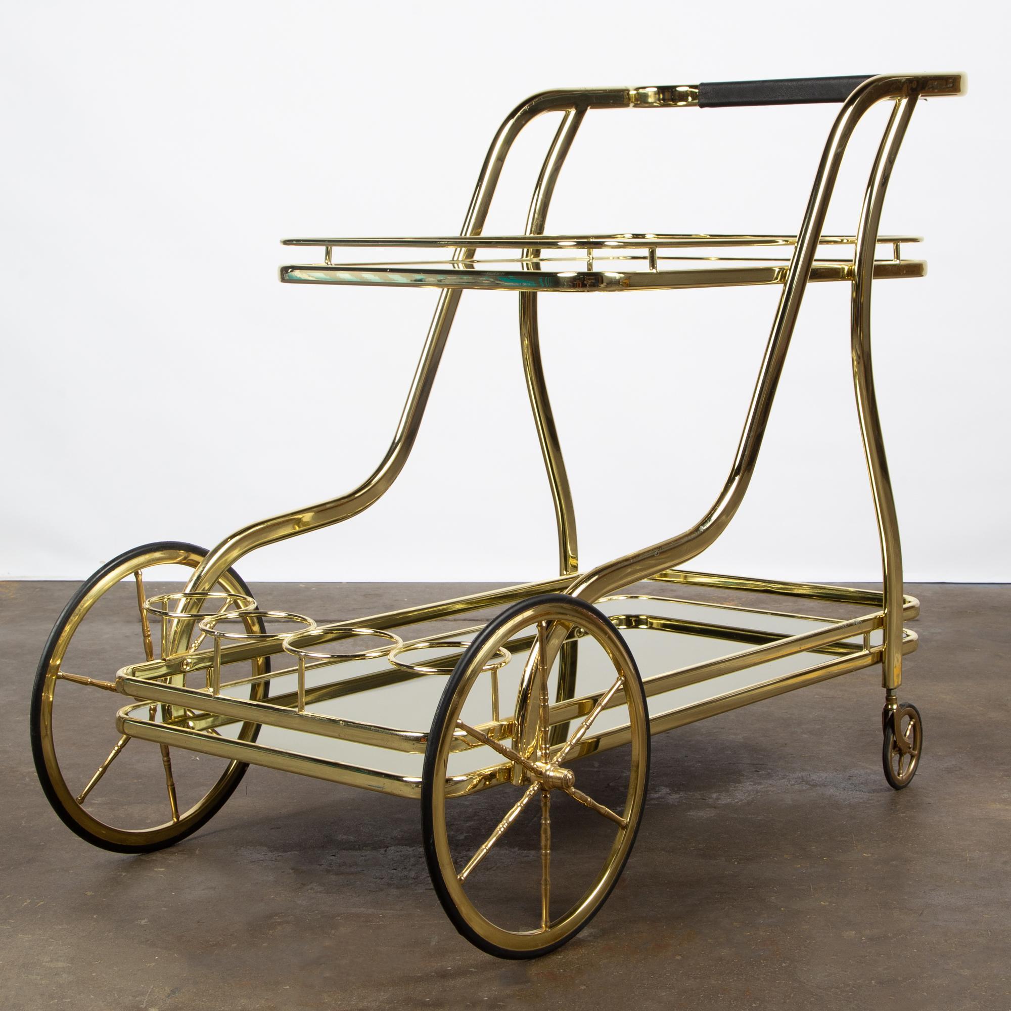 Appraisal: HOLLYWOOD REGENCY TWO-TIER TEA CART A vintage Hollywood Regency style