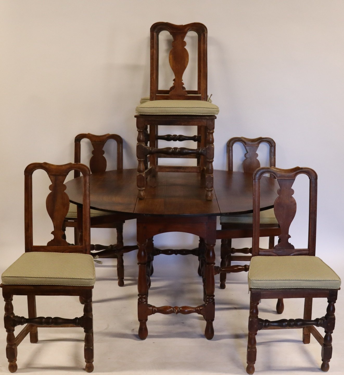 Appraisal: ANTIQUE DROP LEAF TABLE AND CHAIRS Nice set The chairs