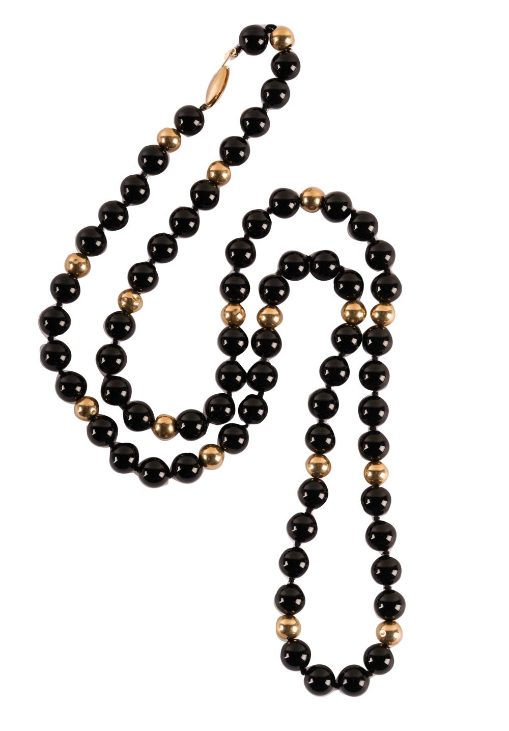 Appraisal: KARAT YELLOW GOLD ONYX BEADED NECKLACEcontaining round gold beads measuring