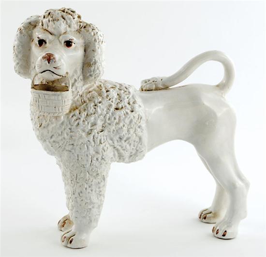 Appraisal: Staffordshire ceramic poodle with basket late th century standing figure