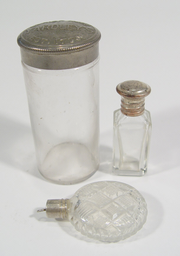 Appraisal: Two cut glass scent bottles with silver metal stoppers and