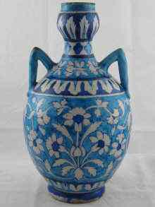 Appraisal: An Indian two handled ceramic vase with bulbous neck with