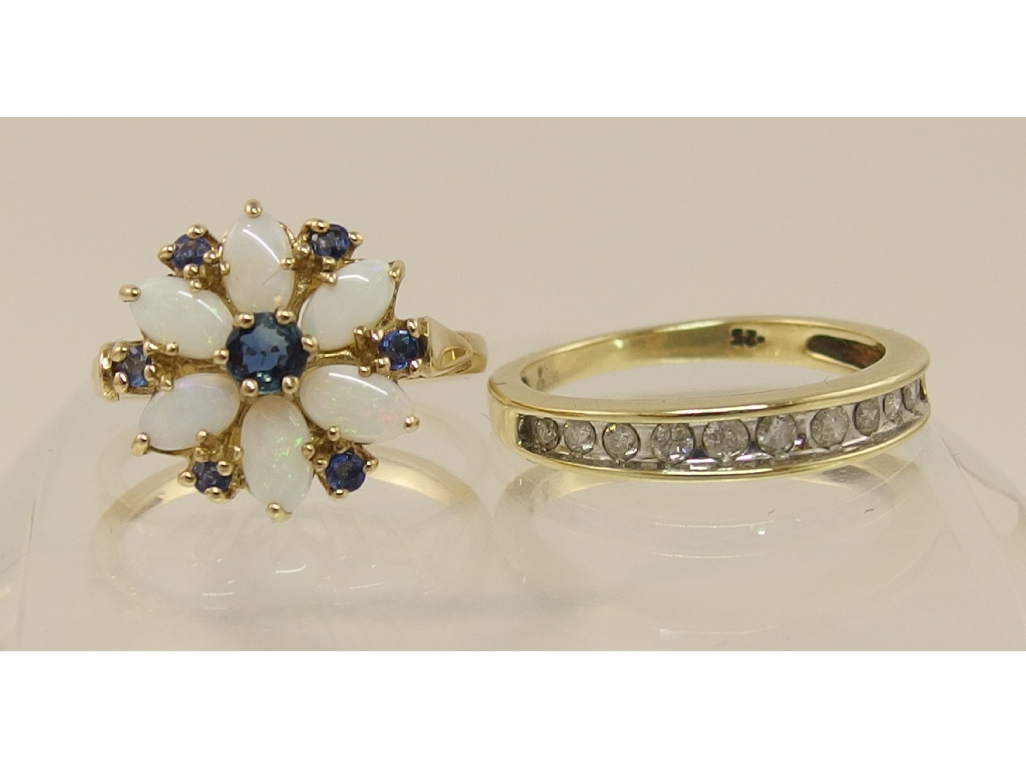 Appraisal: A ct opal and blue gem stone flower ring together