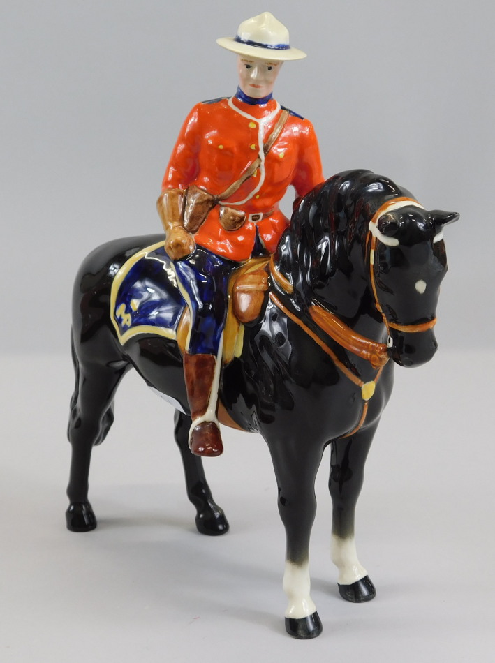 Appraisal: A Beswick ceramic Canadian Mountie with a black horse modelled