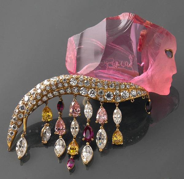 Appraisal: A carved pink glass costume brooch and matching ring