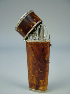 Appraisal: A George III silver mounted tortoiseshell etui with bright cut