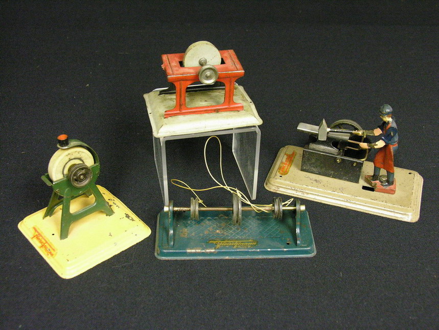 Appraisal: FOUR GERMAN STEAM POWERED TOYS made to operate by steam