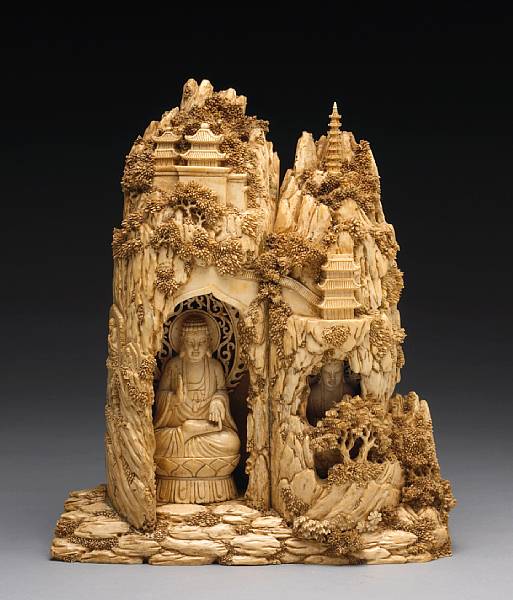 Appraisal: A pieced ivory carving of grottoes and Buddha statues th