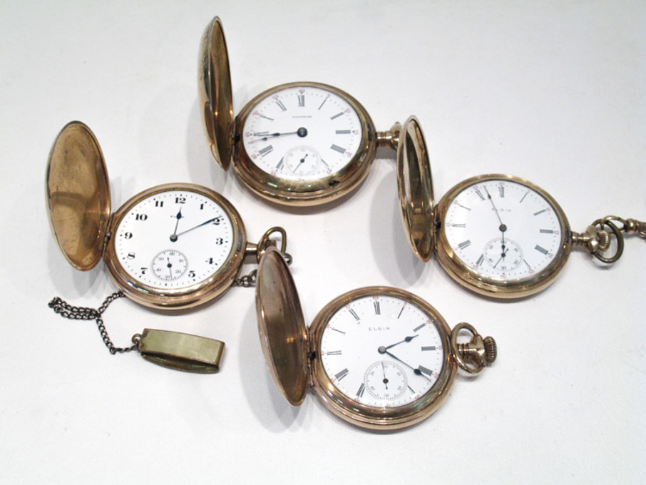 Appraisal: FOUR AMERICAN GOLD PLATED HUNTER CASE POCKET WATCHES American Waltham