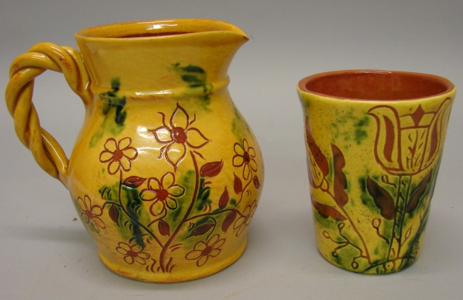 Appraisal: Creamer - applied rope style handle flower motif yellow slip