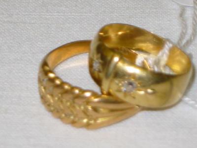 Appraisal: AN CT GOLD BUCKLE RING with two small diamonds size