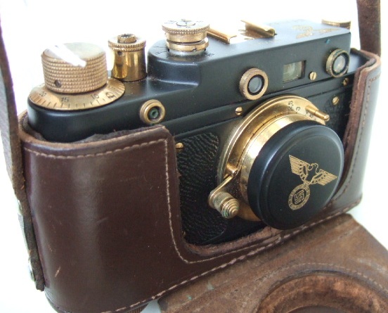 Appraisal: A replica Leica camera with black body and gilt metal