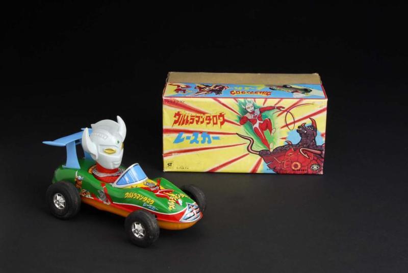 Appraisal: Ultra Man Taro Driving Race Car Toy Description Japanese Made