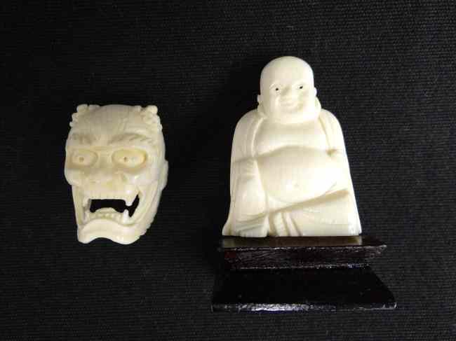 Appraisal: Asian ivory lot Buddha and Devil mask