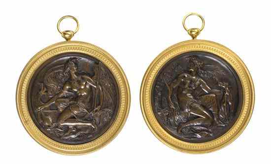 Appraisal: A Pair of Continental Gilt and Patinated Bronze Relief Medallions