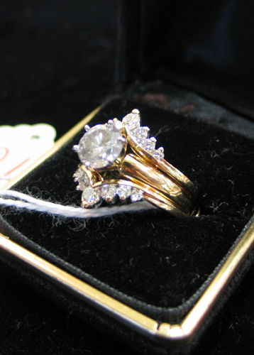 Appraisal: LADY'S DIAMOND WEDDING RING ENSEMBLE WITH APPRAISAL The engagement ring