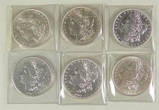 Appraisal: Four Scarce Morgan Dollars Grade range XF-AU with some planchet