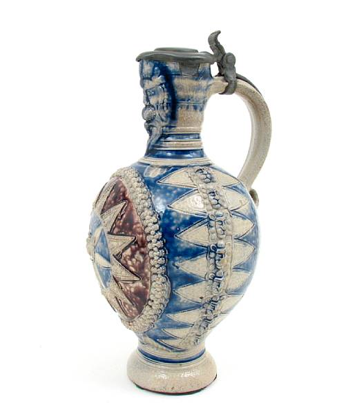 Appraisal: A German stoneware and pewter mounted pitcher height in diamter