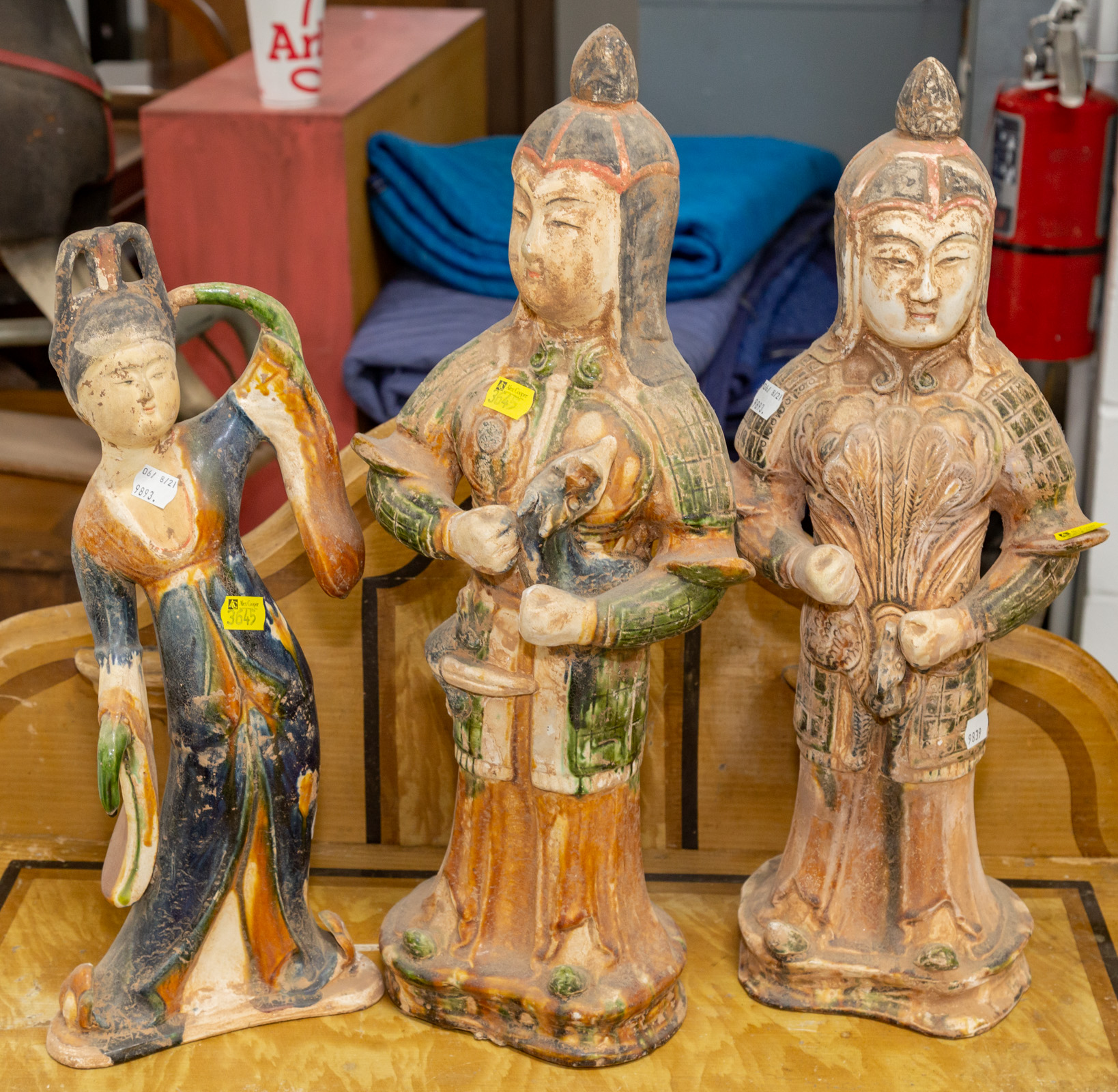 Appraisal: THREE CHINESE TANG STYLE TERRACOTTA FIGURES to in H