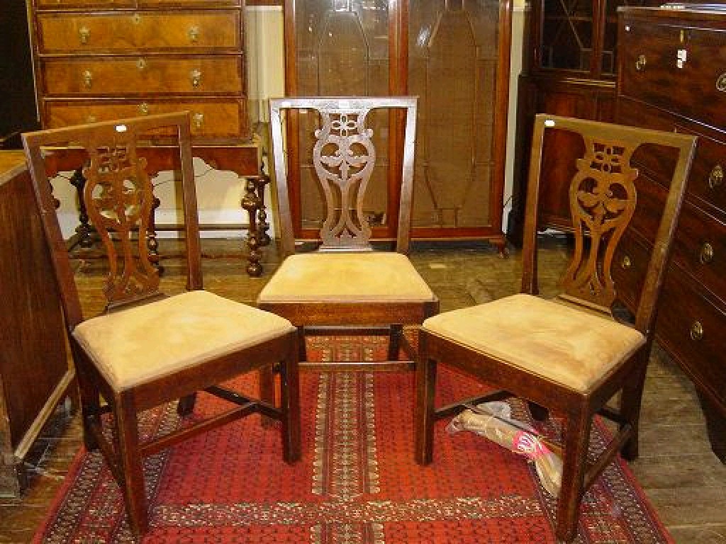 Appraisal: A set of three Georgian mahogany dining chairs with pierced