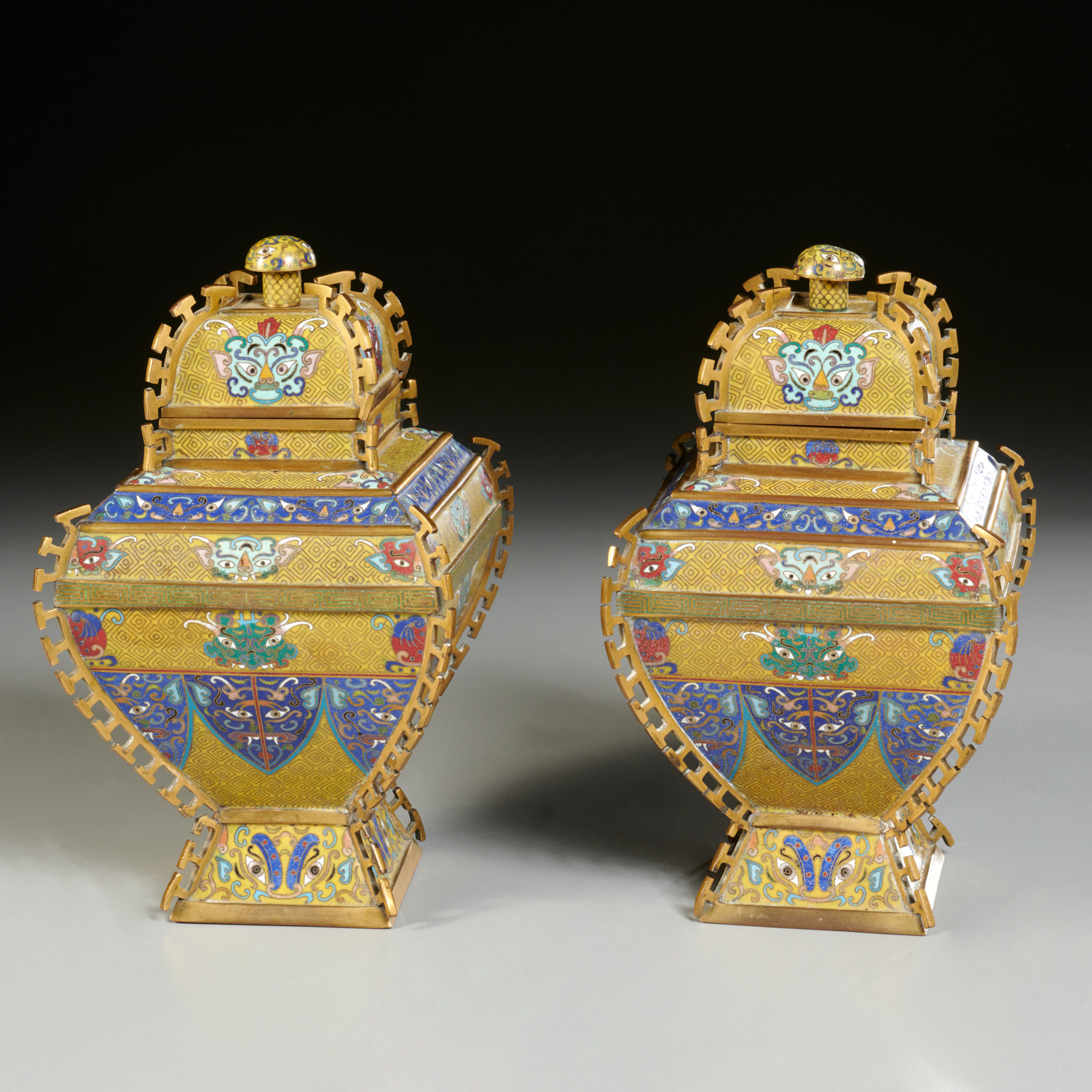 Appraisal: PAIR CHINESE CLOISONNE COVERED TAOTIE JARS th th c gilt