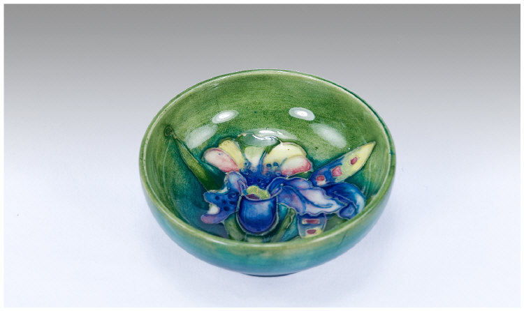 Appraisal: Moorcroft Small Bowl 'Orchid' design on pale green blue ground