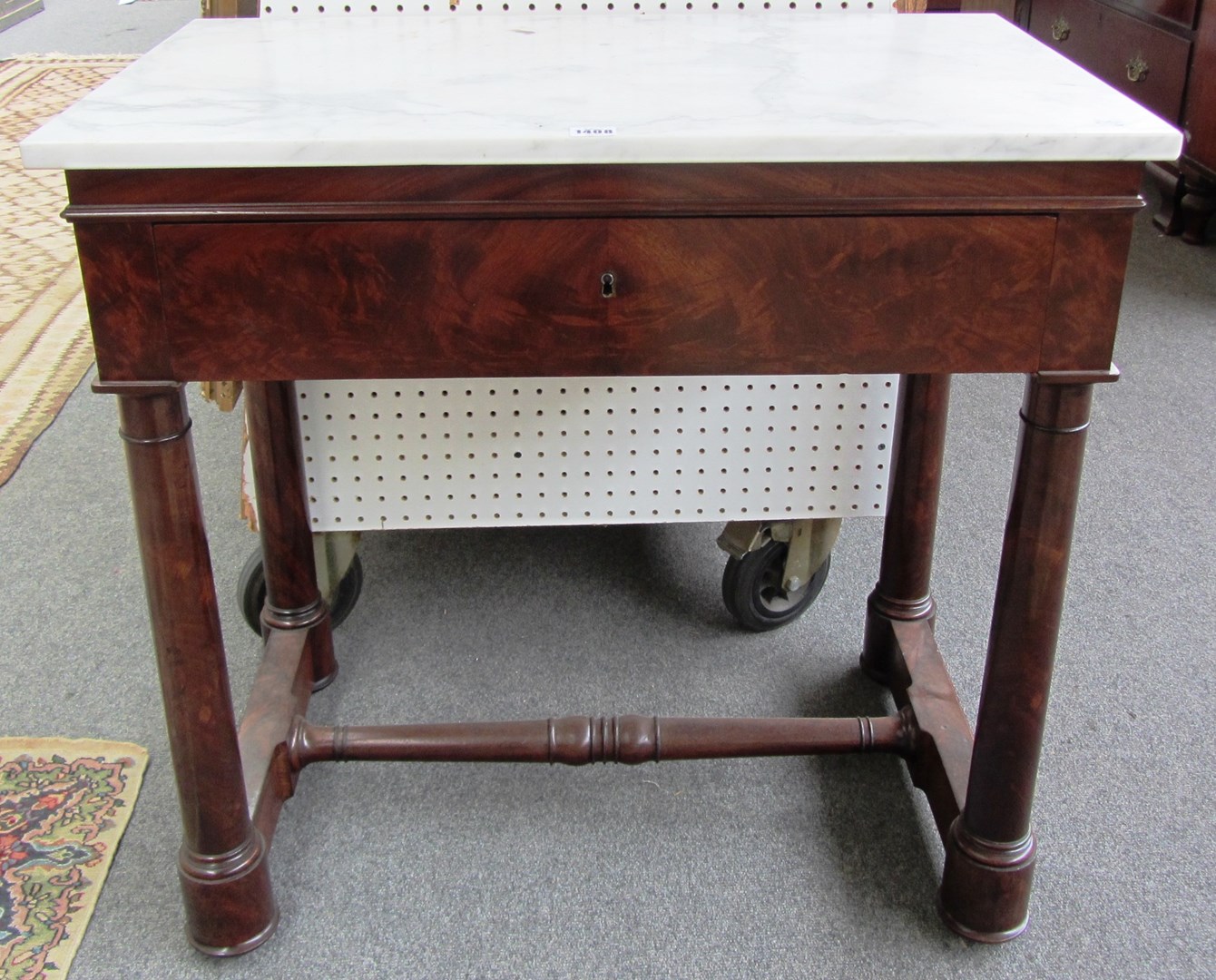 Appraisal: A th century marble topped mahogany single drawer console table